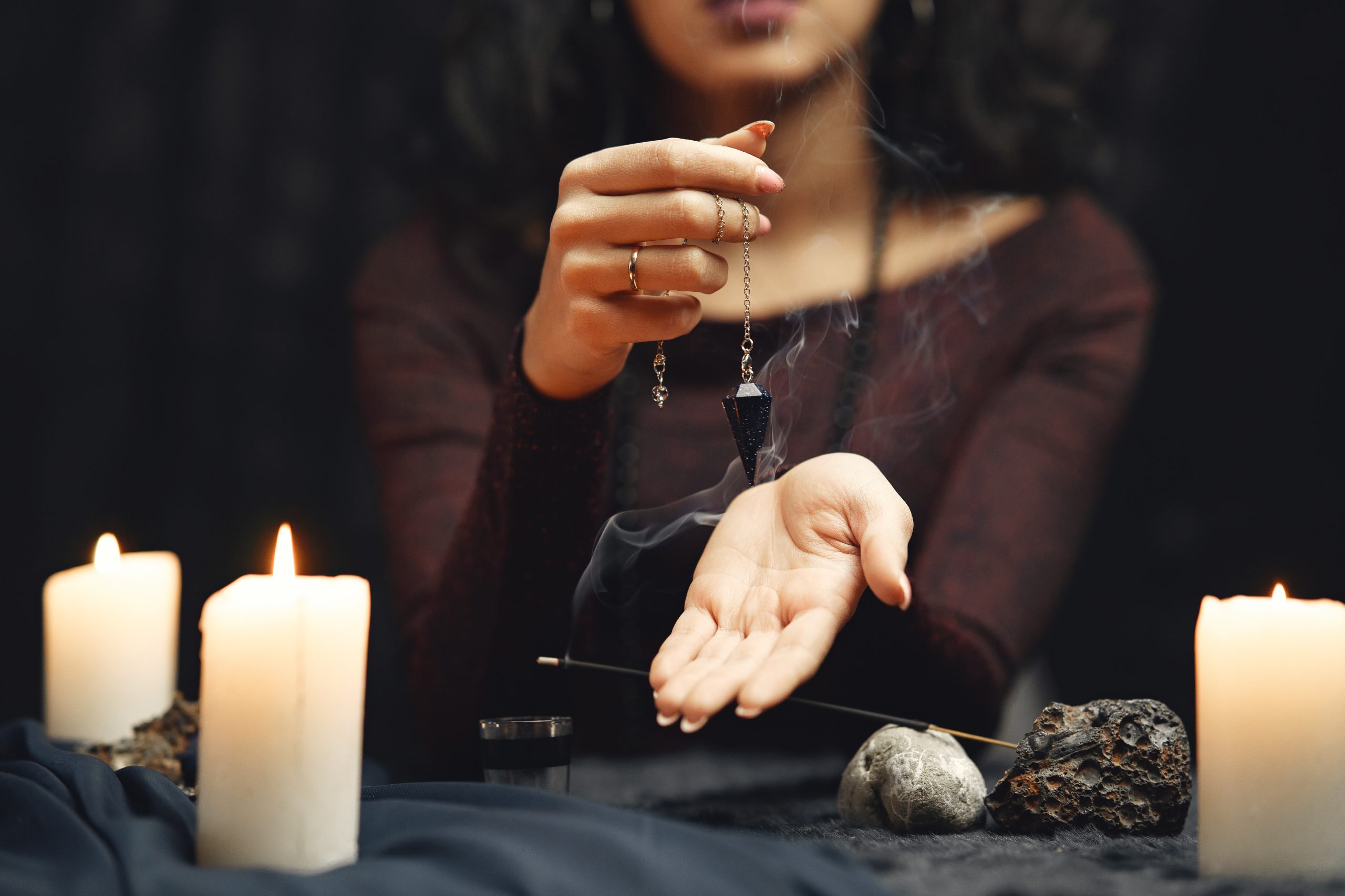 Portrait of fortune-teller in a dark room